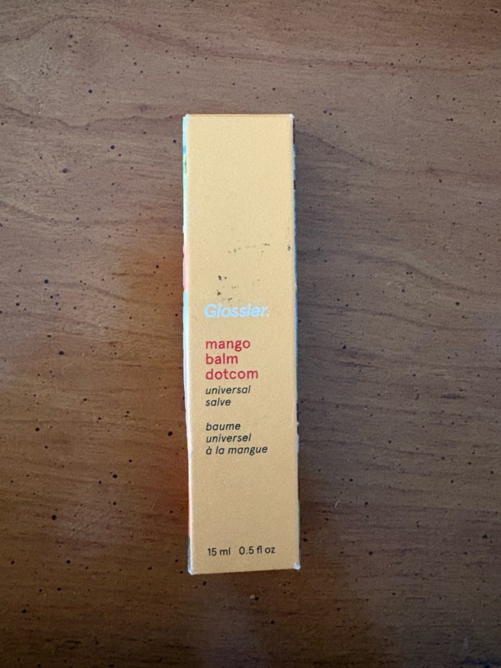 Glossier Mango Balm Dotcom in soft yellow box